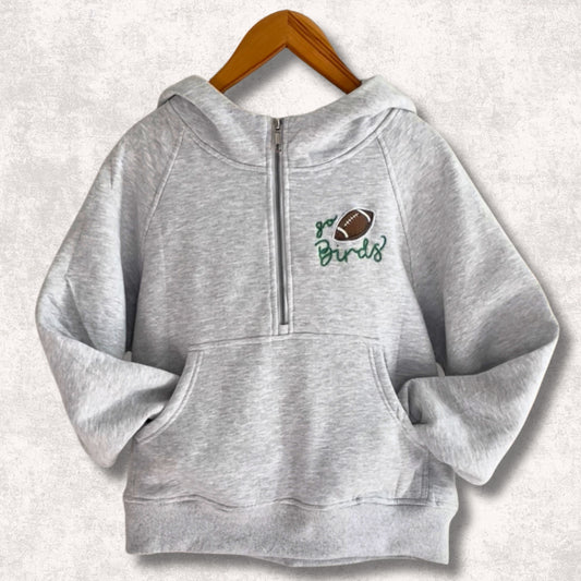 Light grey half zip hoodie with Go Birds embroidered football design on front.